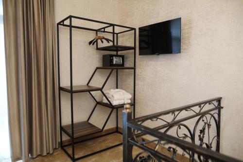 TV a/nebo společenská místnost v ubytování BMG Hotel by Grigoryans Group