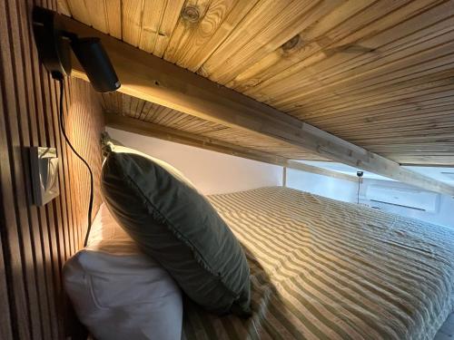 a bunk bed with a pillow in a room at La Floresta Suite in Sant Cugat del Vallès