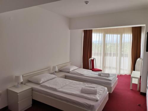 Una cama o camas en una habitación de Plaža