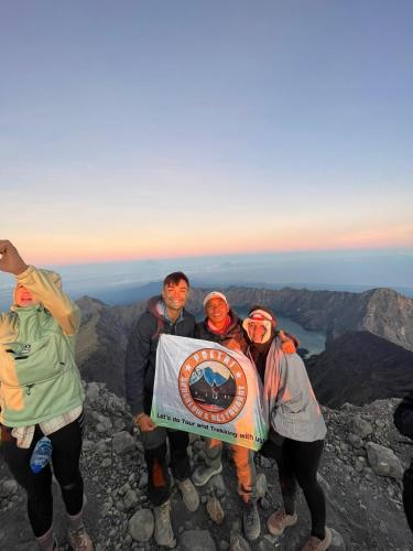 a group of people standing on top of a mountain at Poetri Bungalow & Restaurant in Senaru