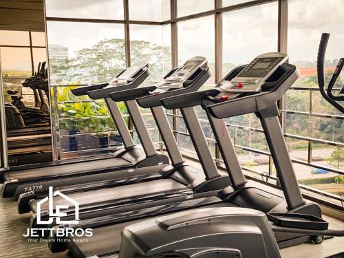 a row of treadmills on a treadmill in a gym at D' Summit Residence By JettBros Johor Bahru in Johor Bahru