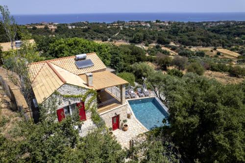 an aerial view of a house with a swimming pool at Villa Zoe (formerly Villa Eboros) in Ratzaklíon