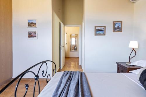 a bedroom with two beds and a hallway at Villa Zoe (formerly Villa Eboros) in Ratzaklíon