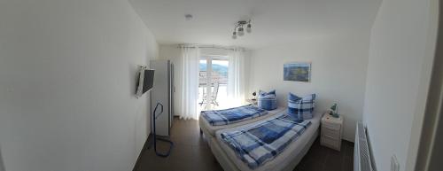 Postel nebo postele na pokoji v ubytování FeWo Lena