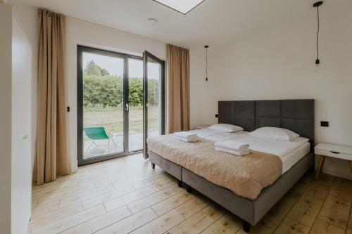 Postel nebo postele na pokoji v ubytování Apartamenty u Cherubinów