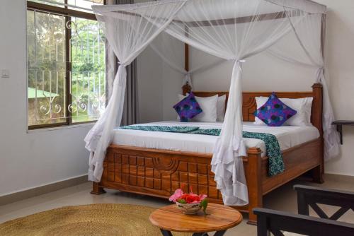 Postel nebo postele na pokoji v ubytování Zanzibar View Hotel
