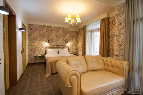 Postel nebo postele na pokoji v ubytování Komilfo Hotel