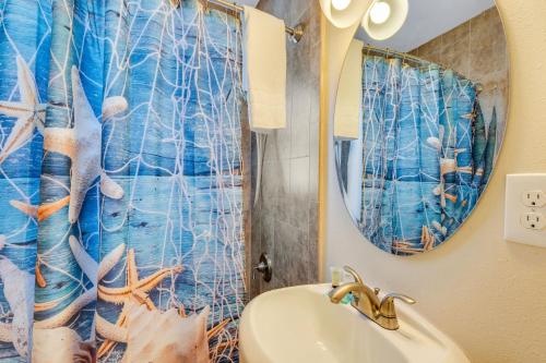 a bathroom with a sink and a mirror at Tropic Terrace Suite #48 - Beachfront Resort in St Pete Beach