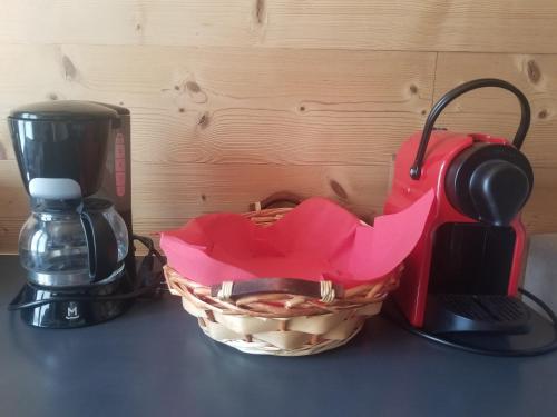a basket sitting next to a coffee maker and a toaster at Chalet Walser à VALLORCINE 13 kms CHAMONIX France in Vallorcine