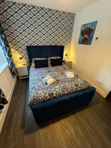 a bedroom with a bed with two candles on it at Woodlands House in Alexandria