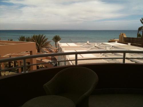 a view of the ocean from the balcony of a hotel at Vai by Romance Hotel & Aqua Park in Ain Sokhna