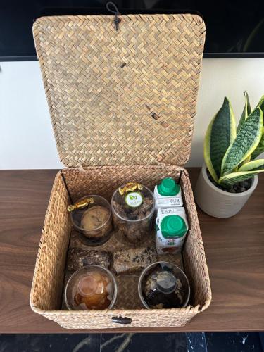 a basket with food and drinks on a table at La vie luxury suites in Megalochori
