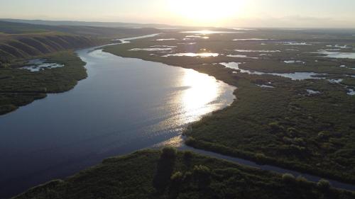 an aerial view of a river at sunset at Delta Sunrise in Somova