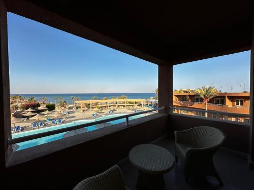 a view of the beach from a resort balcony at Vai by Romance Hotel & Aqua Park in Ain Sokhna