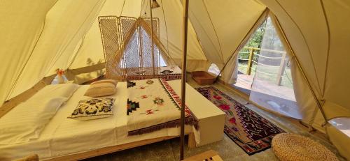 a bedroom with a bed in a tent at Delta Sunrise in Somova