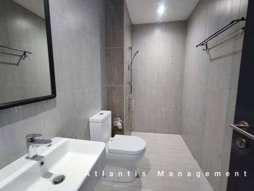 a bathroom with a white toilet and a sink at Sungai Besi, Uno Promenade, Nearby Bukit Jalil & Salak Selatan MRT by Atlantis Management in Kuala Lumpur