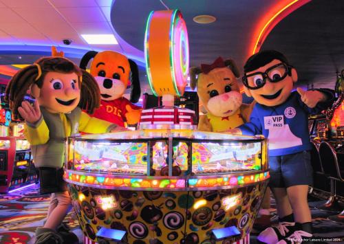 a group of goofy characters standing next to a pinball machine at Golden Palm Resort in Chapel Saint Leonards