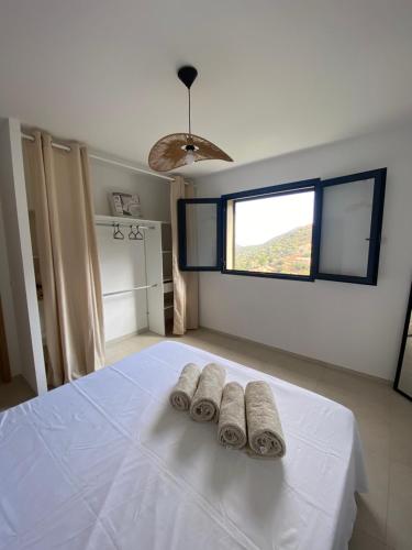 Postel nebo postele na pokoji v ubytování Grande maison à Belgodère Balagne
