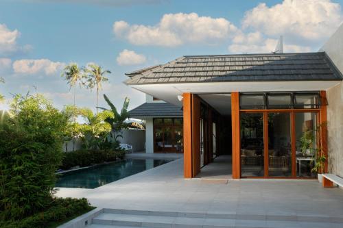 a villa with a swimming pool and a house at The Spring House in Irosin