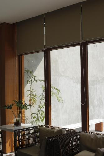 a living room with a couch and a large window at The Spring House in Irosin