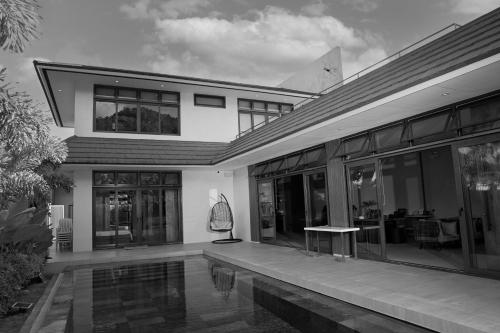 a black and white photo of a house at The Spring House in Irosin