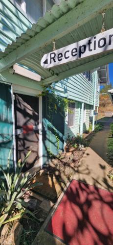 a house with a foreclosure sign on the side of it at Meyenburg Units in Mount Morgan