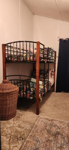 a room with two bunk beds in a room at Meyenburg Units in Mount Morgan