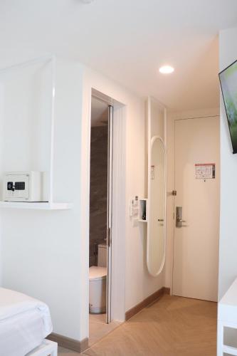 a bathroom with a shower in a room at ResT Bangkok Poshtel in Bangkok