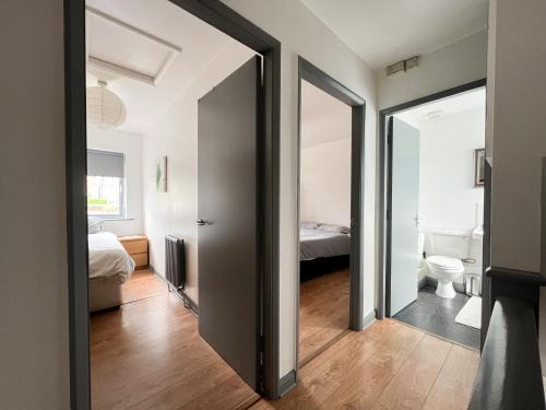 a room with a door leading to a bedroom at Well-equipped 4 Bedroom House close to City Centre in Leeds