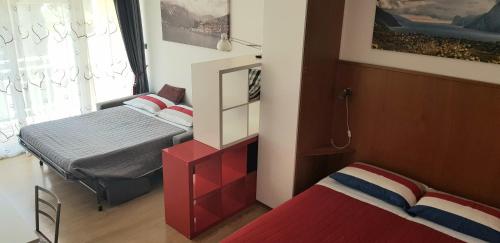 Postel nebo postele na pokoji v ubytování Lake Garda Bike&Hike Apartment