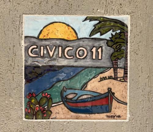 レッジョ・ディ・カラブリアにあるCivico 11の「givota」と書かれた看板の絵