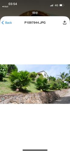 a screenshot of a page of a website with a picture of a house at Ogumka 2 , self catering , Santa Maria , Mahe , Seychelles in Anse Royale