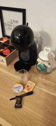 a coffee maker sitting on top of a wooden table at Antica Dogana in Sarzana