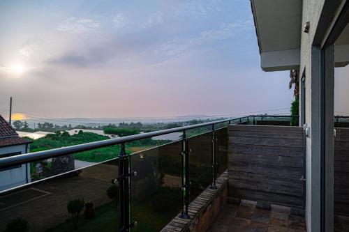 a balcony of a house with a view at Le Village Aewol building A in Jeju
