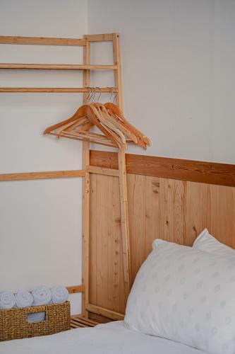 a bedroom with a bunk bed and a ladder next to a bed at Le Village Aewol building A in Jeju
