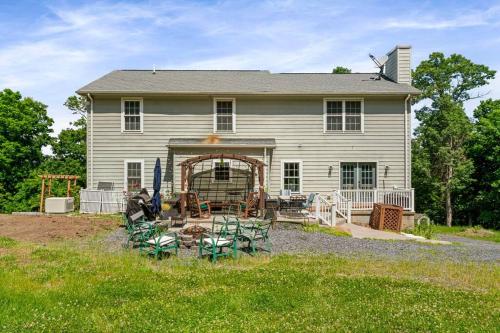 a house with a yard with chairs and a patio at Multi-gen Family Mountain House in Front Royal