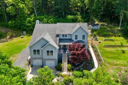 an aerial view of a blue house with a garage at Multi-gen Family Mountain House in Front Royal