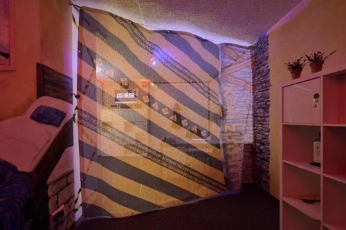 a room with a wall covered in stripes at Hotel Schönbuch in Pliezhausen