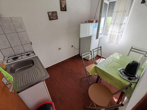 Kuchyň nebo kuchyňský kout v ubytování Apartmani Vodice