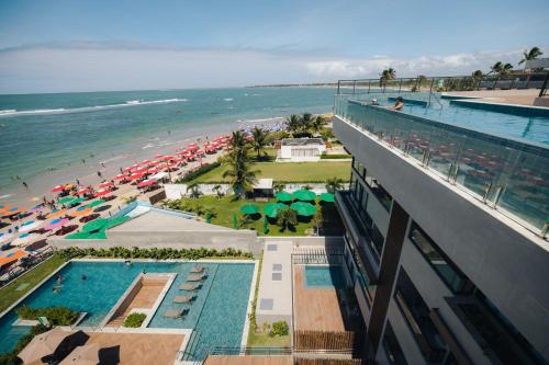 an aerial view of a resort with a beach at Mirante do Porto in Porto De Galinhas