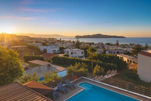 a villa with a pool and a view of the ocean at Seaview Garden Villa - Heated Pool & Sauna in Stalos