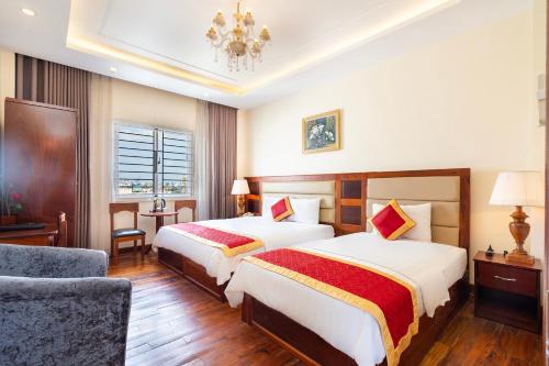 Postel nebo postele na pokoji v ubytování Kadupul Hotel