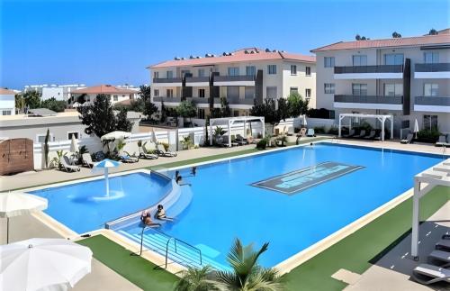an image of a large swimming pool in a building at My Mythical Pearl in Protaras