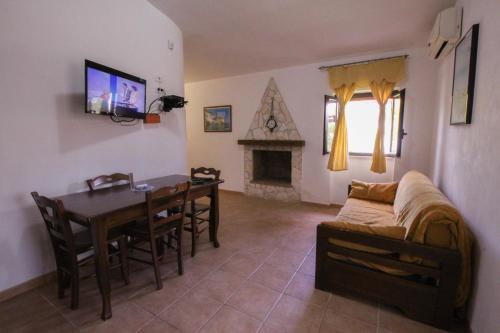 a living room with a table and a couch at Tenuta Padre Pio in Vieste