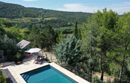 a swimming pool with a view of the mountains at Coste in Mollans-sur-Ouvèze