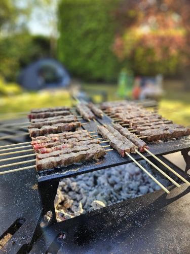 a grill with a bunch of food on it at L Escale Nature in Tournai