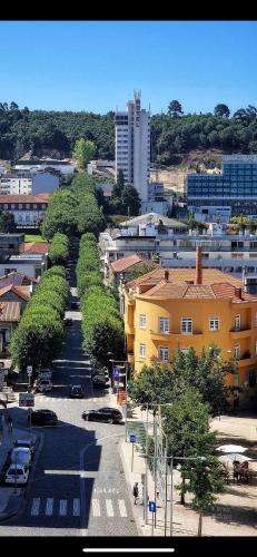 a city with cars parked in a parking lot at FERREIRA'S HOUSE Guimarães in Guimarães