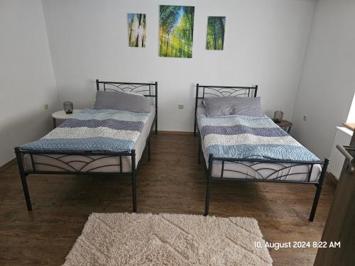 Postel nebo postele na pokoji v ubytování Bungalow ,, Zur langen Heide,,