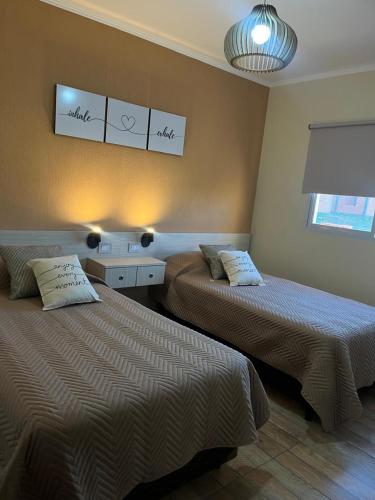 Ένα ή περισσότερα κρεβάτια σε δωμάτιο στο Cabañas las Consentidas by aritoys termas M Grande