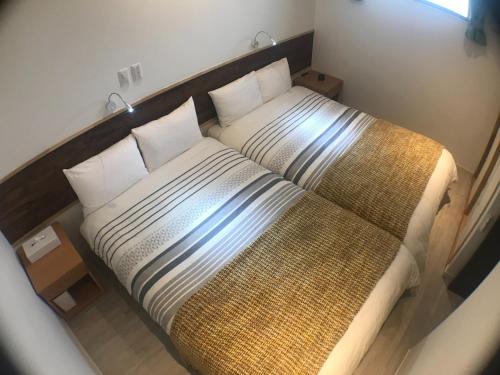 Giường trong phòng chung tại Niruyakanaya BISE - Vacation STAY 58179v
